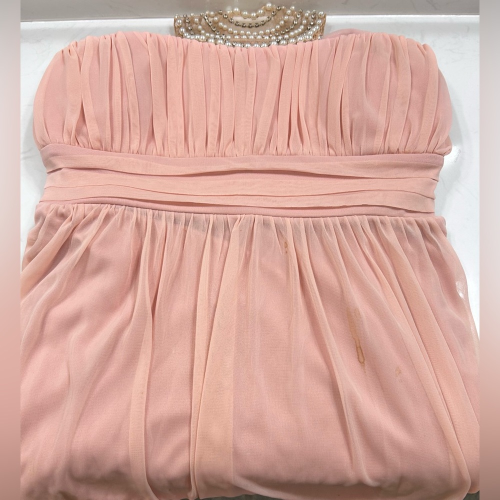 Long pink strapless bridesmaids dress with beaded neck line attachment